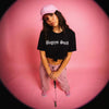Woman in Muni Kids Dad Hat (Pink) and Bogeys Suck T-Shirt in pink studio